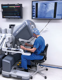 A photo showing John D. Puskas, MD, who performed robotic coronary artery bypass grafting in stage one of a hybrid coronary revascularization procedure.