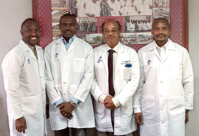 A photo at the John F. Kennedy Medical Center in Monrovia, Liberia, shows physicians Ehigha Enabudoso, MD, Edwin Olokor, MD, Etedafe Gharoro, MD, and Ayyuba Rabiu, MD, are among staff members funded by the World Bank Workforce grant.