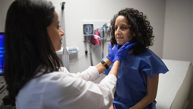 Doctor examines patient