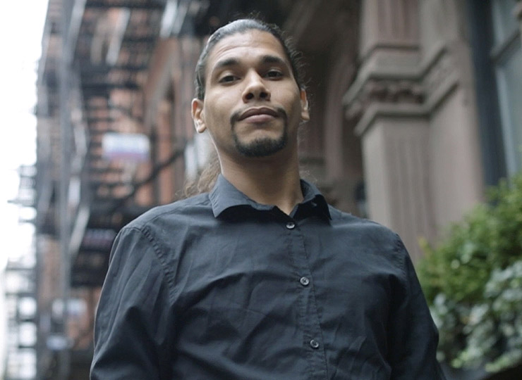 Photo of individual standing on city sidewalk