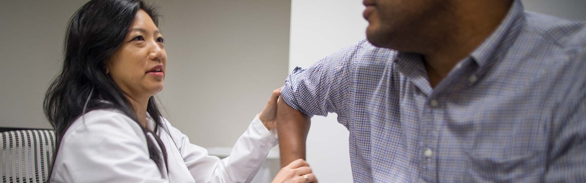 doctor examines patient