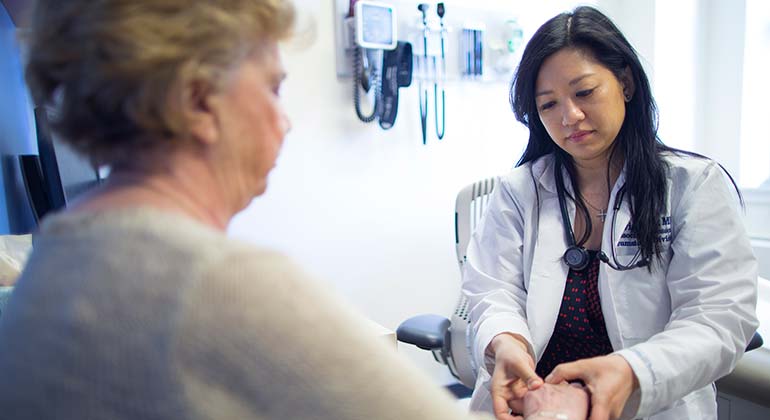 doctor holds patient