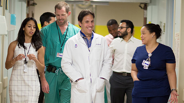 Doctors and staff walking down the hall