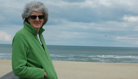 Photo of patient Claudia Hirsch on a beach