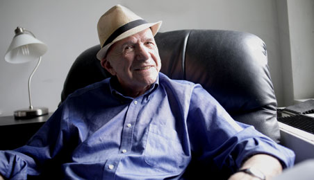 Photo of patient Ben Kolbert sitting in a chair