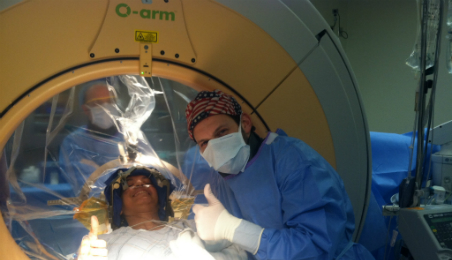 Photo of patient Suelai Hidalgo in a CT machine
