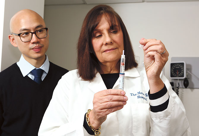 Female Nurse With Syringe