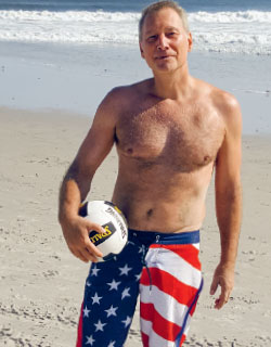 Image of Roy Rutledge playing beach volleyball