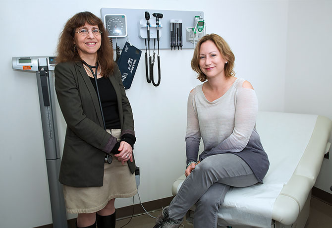 A photo of Carol J. Levy, MD, with her patient Lisa, who has participated in four artificial pancreas trials.