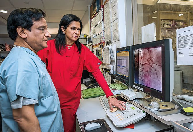 A photo of Samin K. Sharma, MD, and Annapoorna S. Kini, MD
