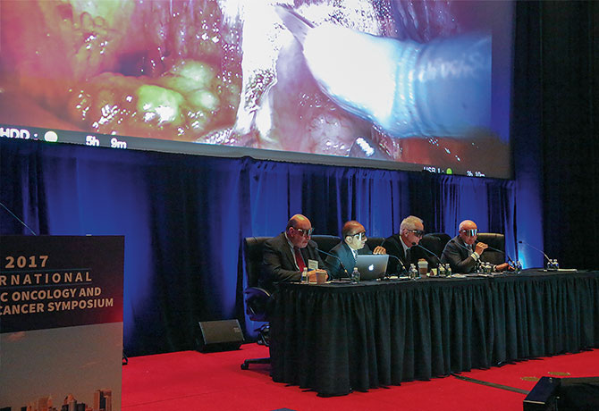 Photo shows a live 3D robotic procedures broadcast to the audience from the operating room