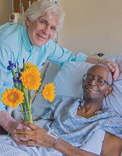 A photo showing Jeffrey Dicker and his husband, Jeremiah Miller, at the Wiener Family Palliative Care Unit (PCU) at The Mount Sinai Hospital.