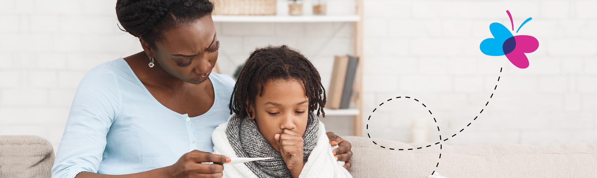 Woman taking temperature of baby