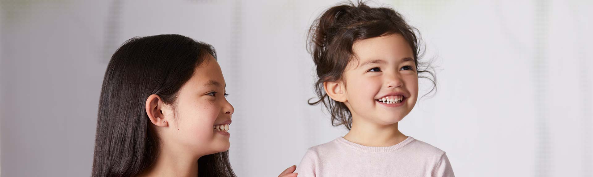Image of two girls laughing