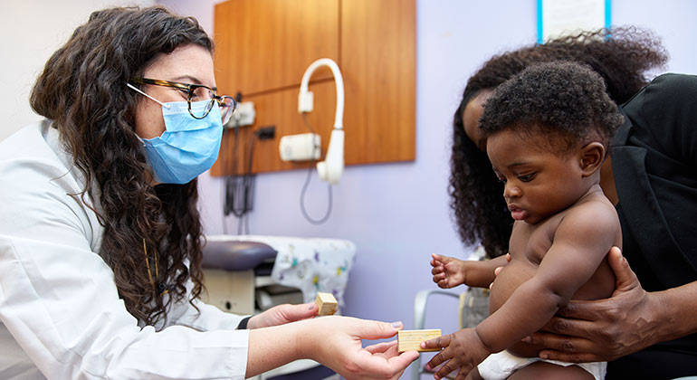 Image of nurse with baby