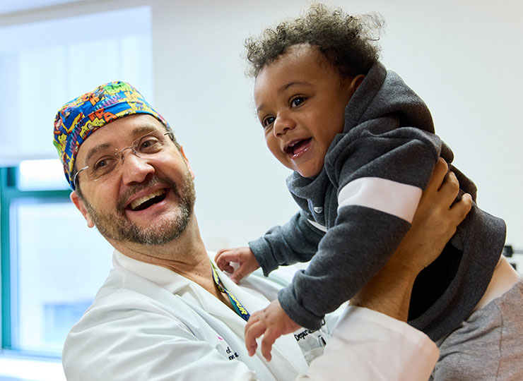 Photo of Image of doctor holding baby