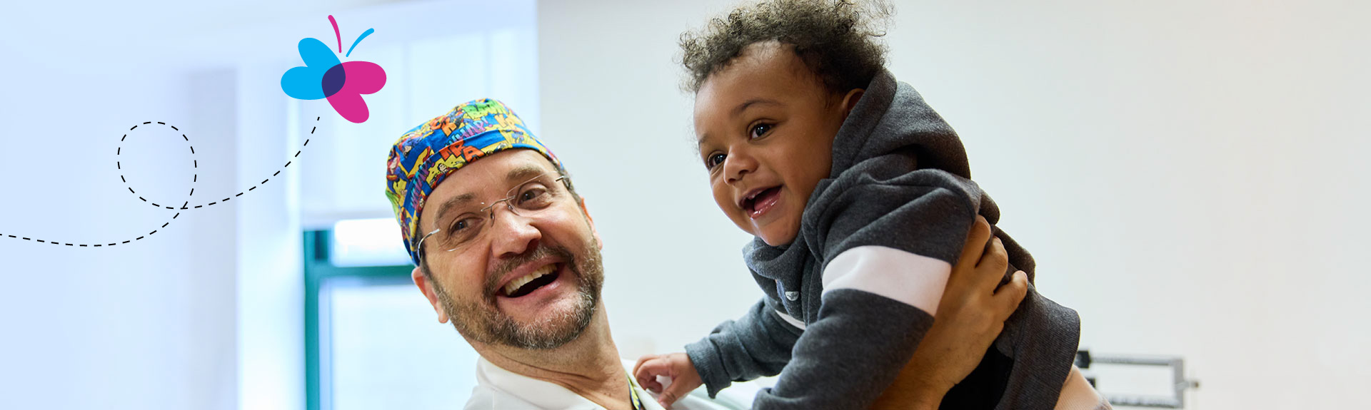 doctor holding an infant patient