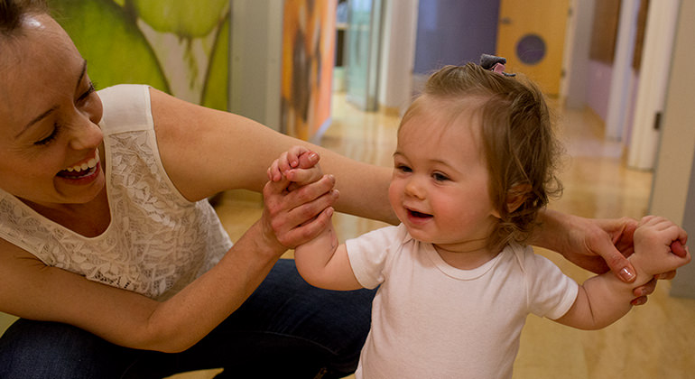 Little girl walking in hospital hallway