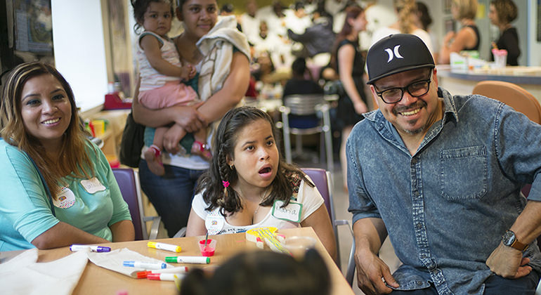 Children and families at event with social workers