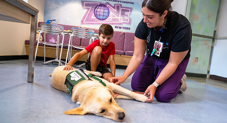 Image of child with dog