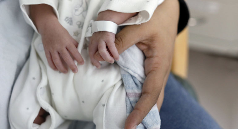 Doctor examining baby