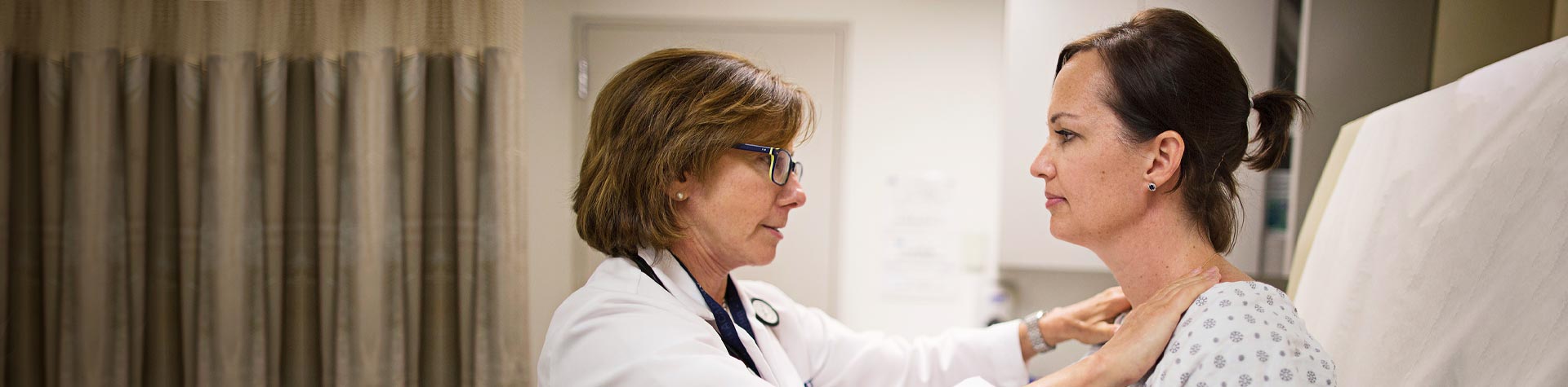 Image of doctor examining patient