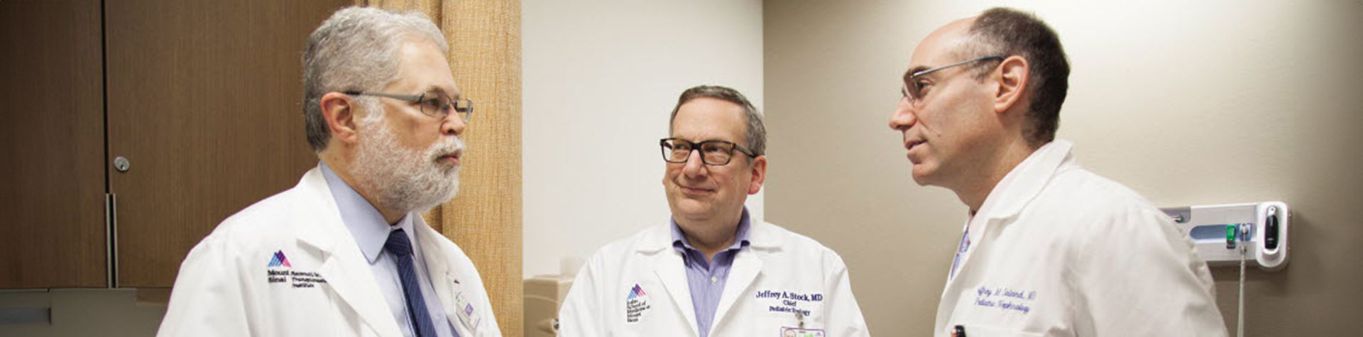 Image of three doctors talking