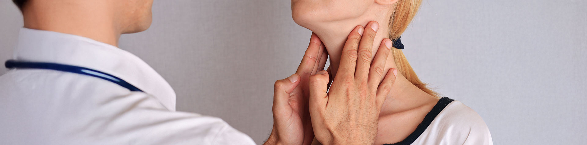 doctor checking patient throat