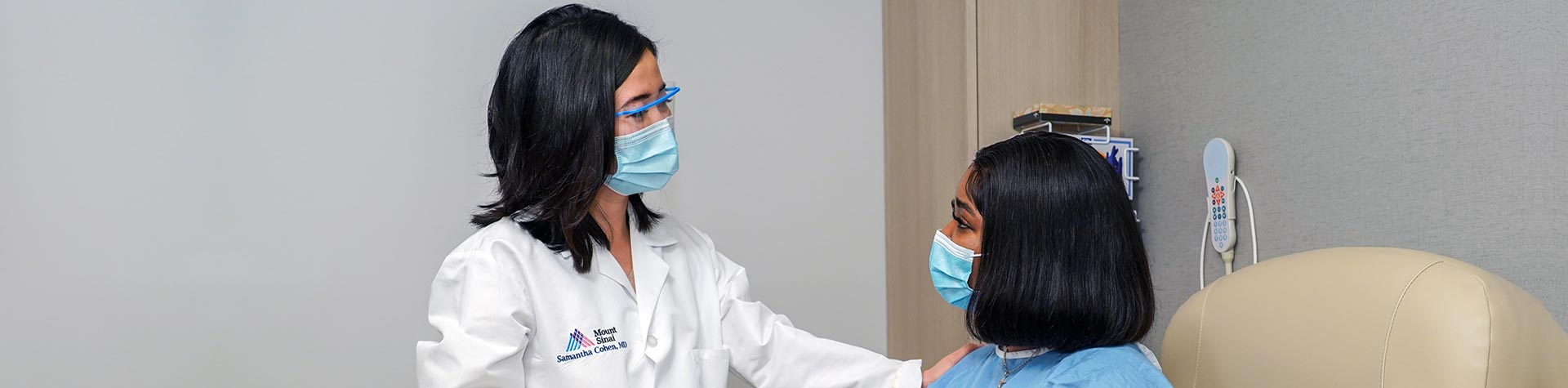 Masked doctor and patient