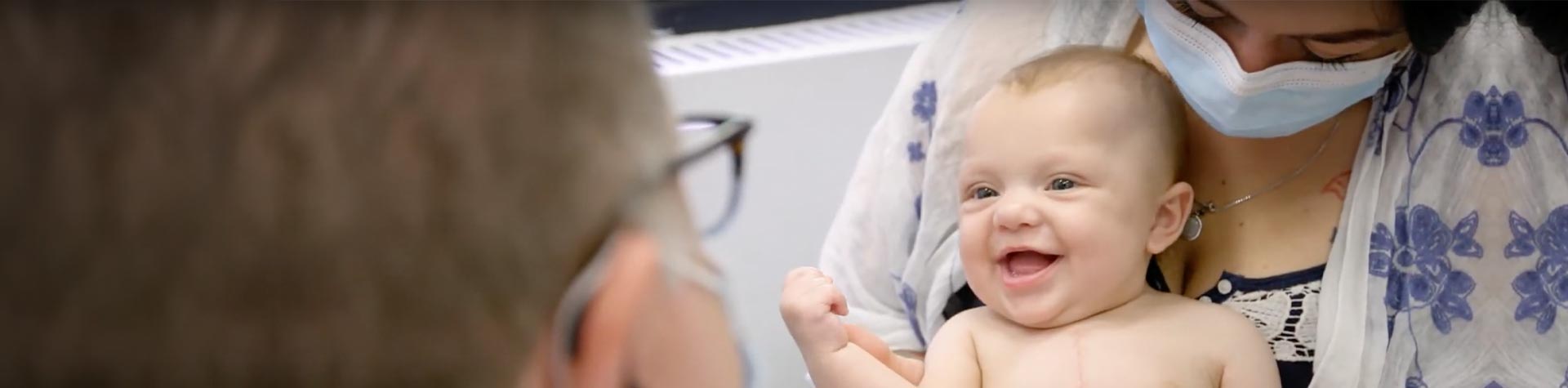 doctor holding infant patient