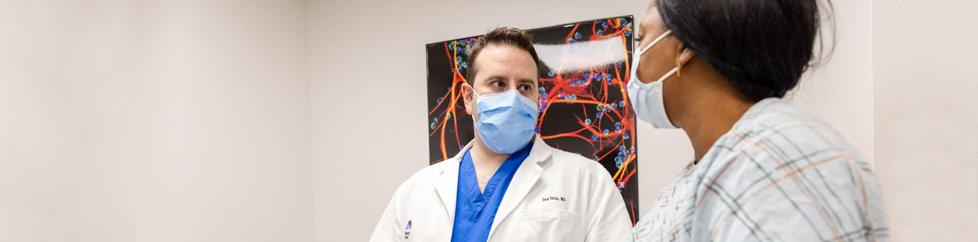 image of doctor talking with patient