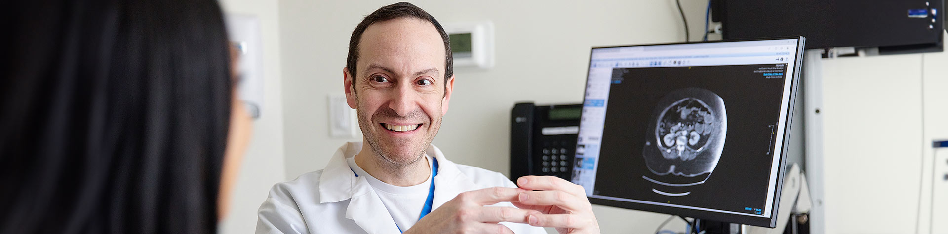 doctor going over scan w/ patient