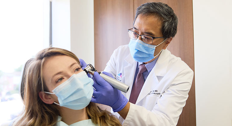 Image of doctor examining patient