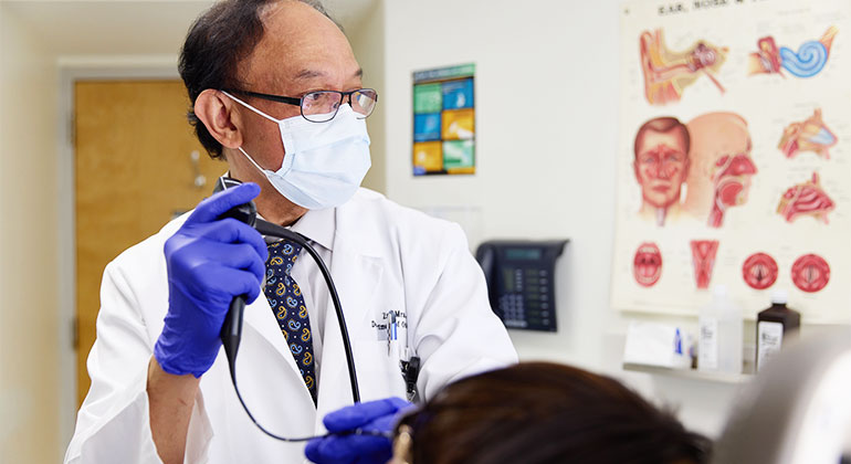 Image of doctor examining patient