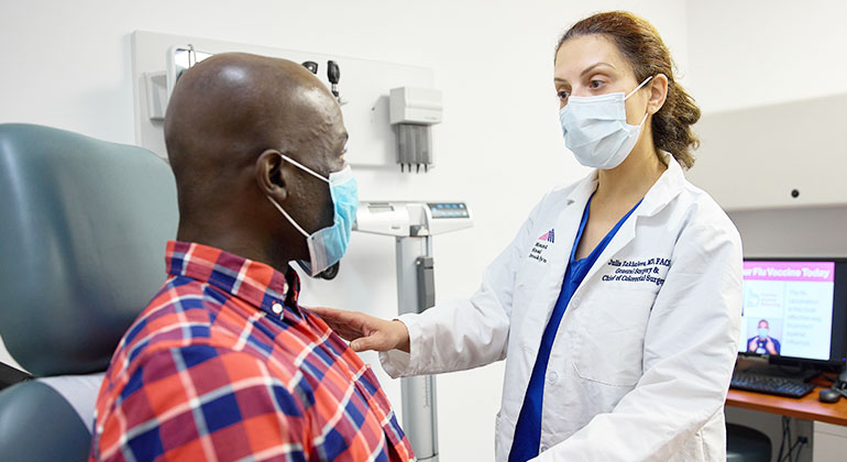 Image of doctor examining patient