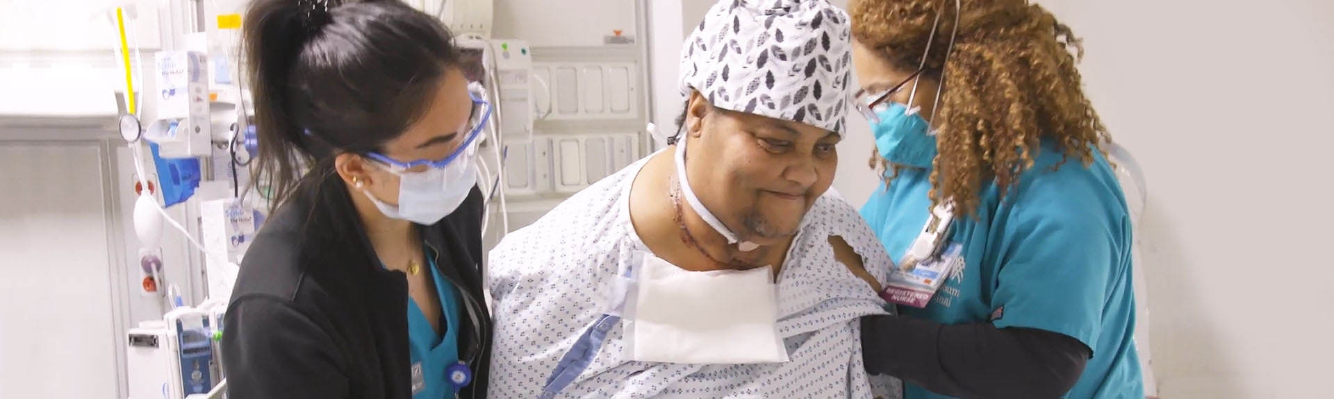 Image of nurses helping patient