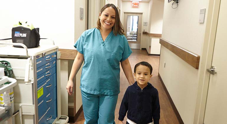 doctor walking with child