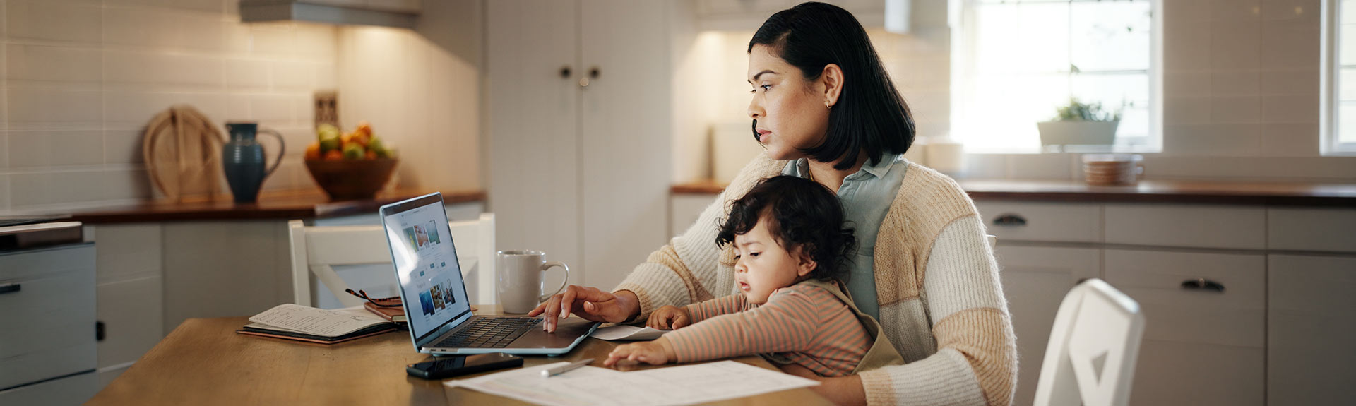 Woman with child on a computer