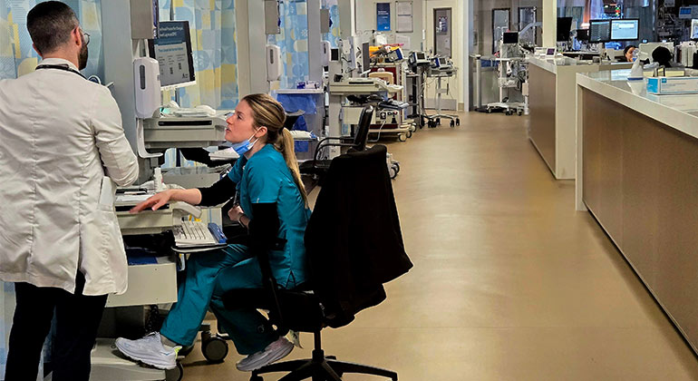 Image of doctor and nurse talking