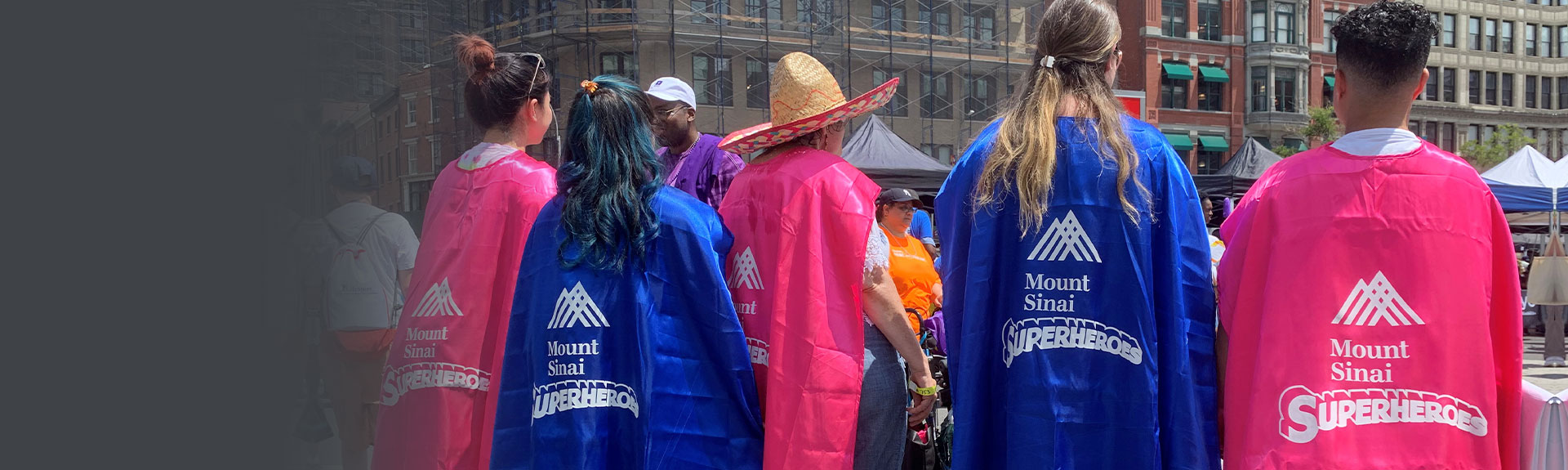 Group of people wearing superheroe capes