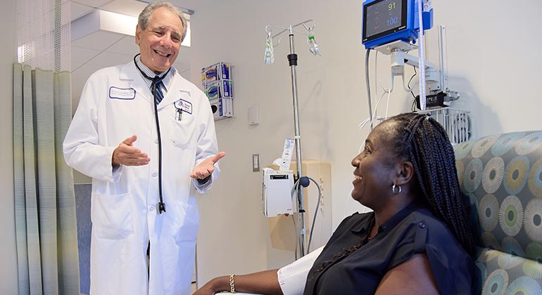 doctor talking to patient in exam room