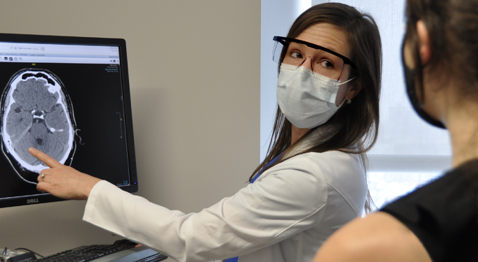 Image of doctor showing patient brain scan results