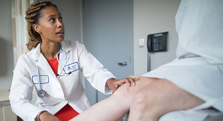 Image of doctor examining patient