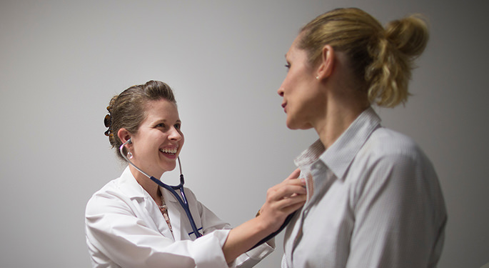 Doctor listening to patient