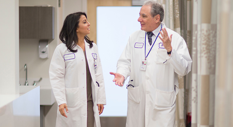 Doctors walking in hallway, talking