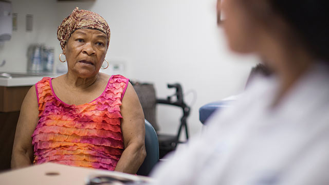 translation services; medium shot of patient with doctor in foreground