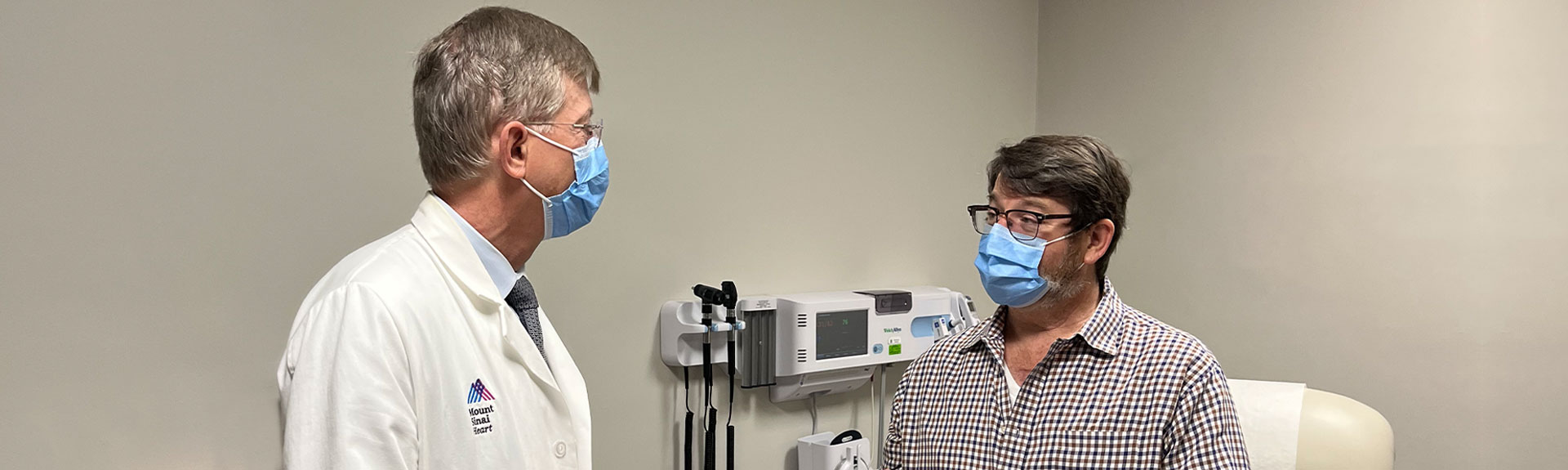 Image of doctor talking to patient