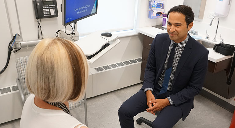 Image of doctor talking to patient