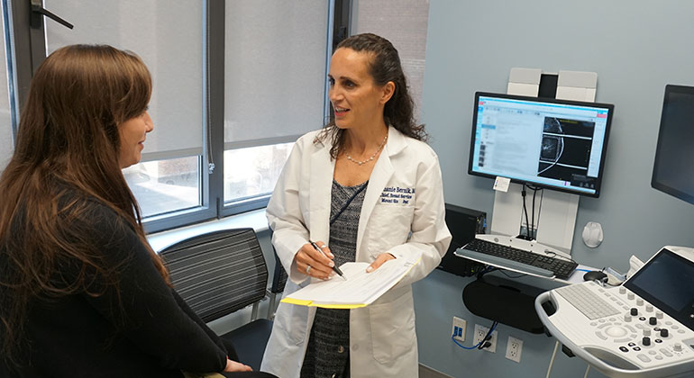 Image of doctor talking to patient