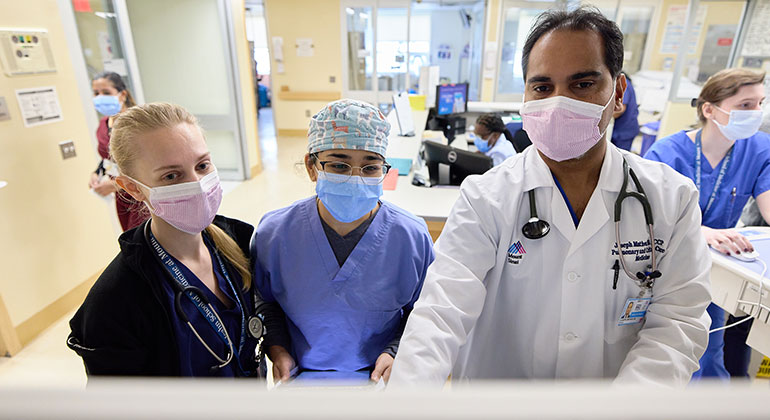 ICU doctors reviewing patient info